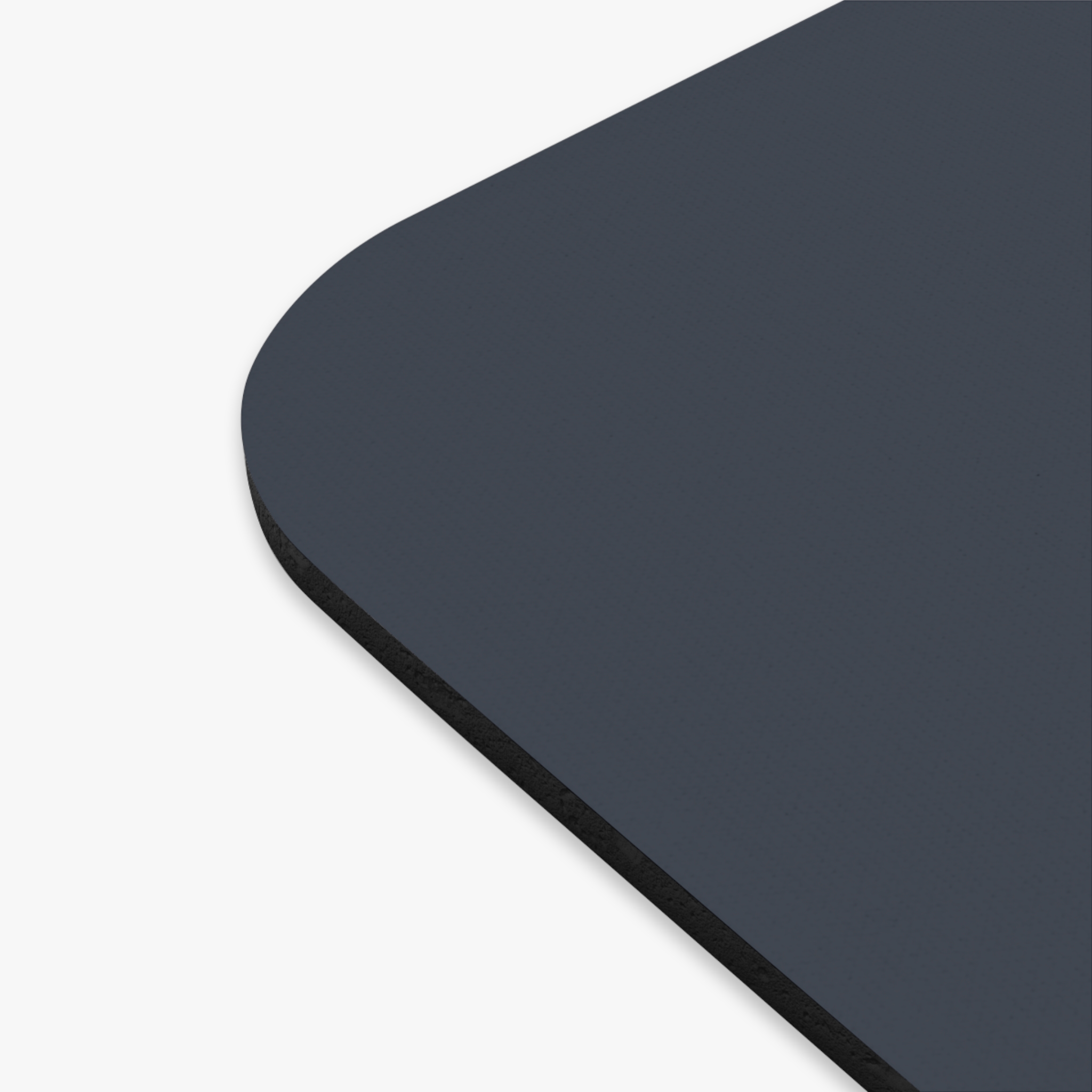 Close-up of the rounded corner of the Lion Logo Mouse Pad — a minimal dark blue desk mat for office & gaming, featuring a textured surface with black edges, shown against a white background.