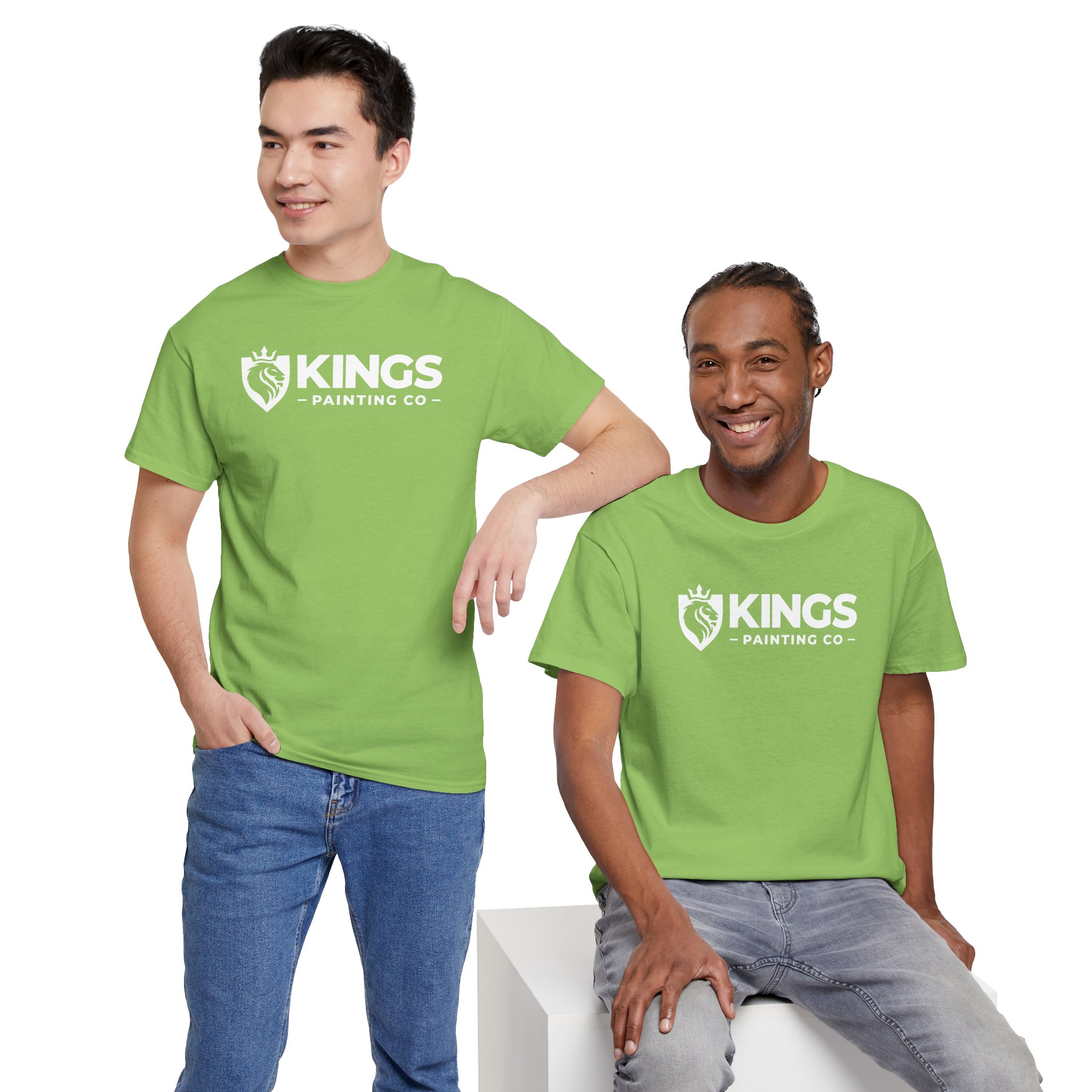Two people, both smiling and looking in different directions, stand and sit against a plain white background while wearing matching light green Kings Painting Co. Logo T‑Shirts (Classic) made with Gildan Ultra Cotton (G5000).