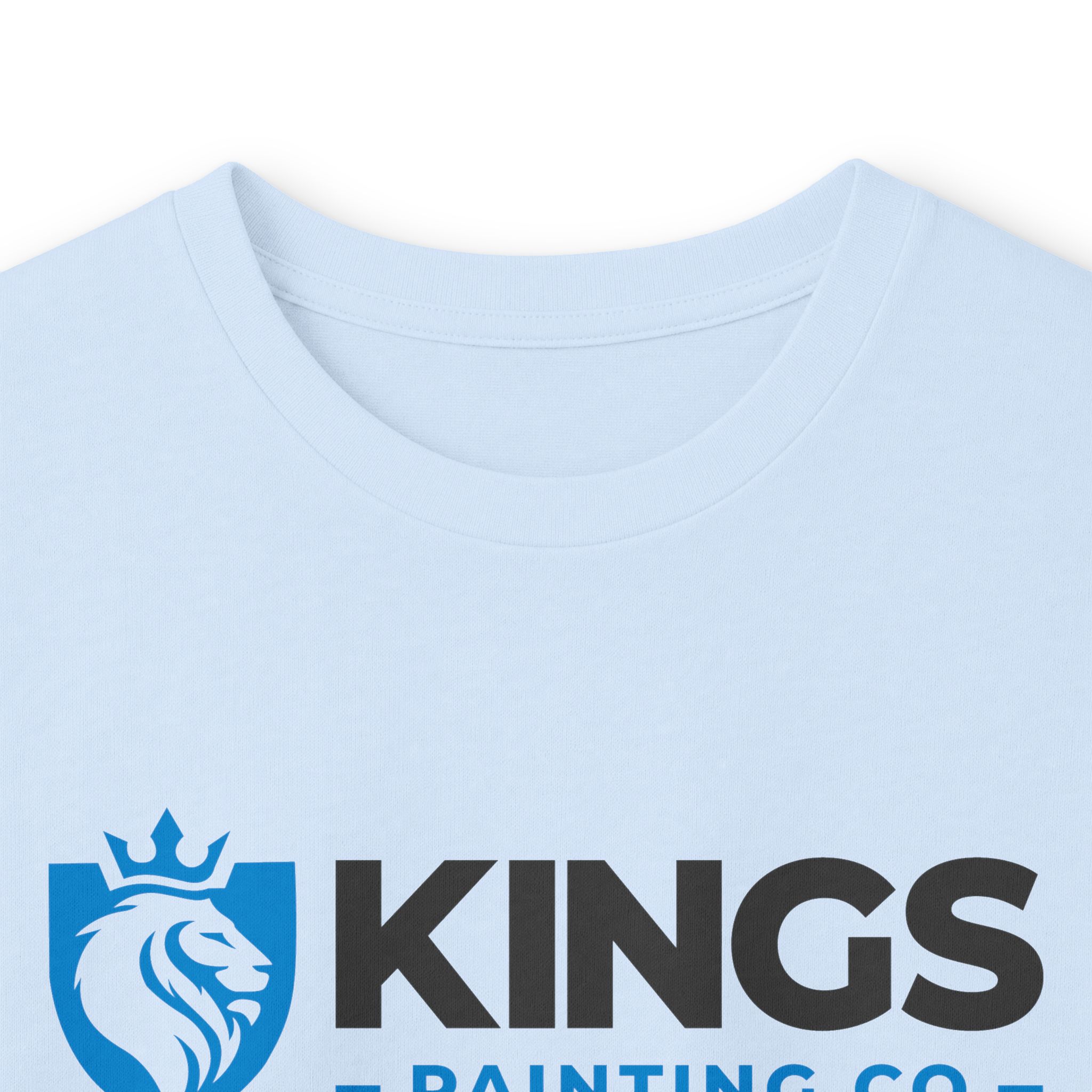 Light blue Kings Painting Co. Long Sleeve Tee (Gildan 2400) featuring a logo of a lion’s head inside a shield with a crown above, positioned next to bold black “KINGS PAINTING CO.” text; only the upper chest area of the shirt is visible.